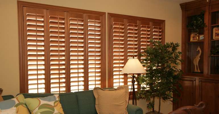 Natural wood shutters in Dallas living room.